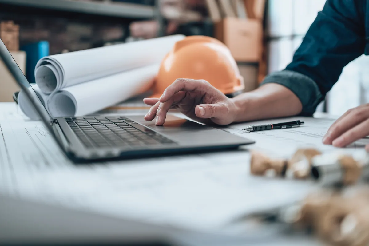 Architect working over blueprints