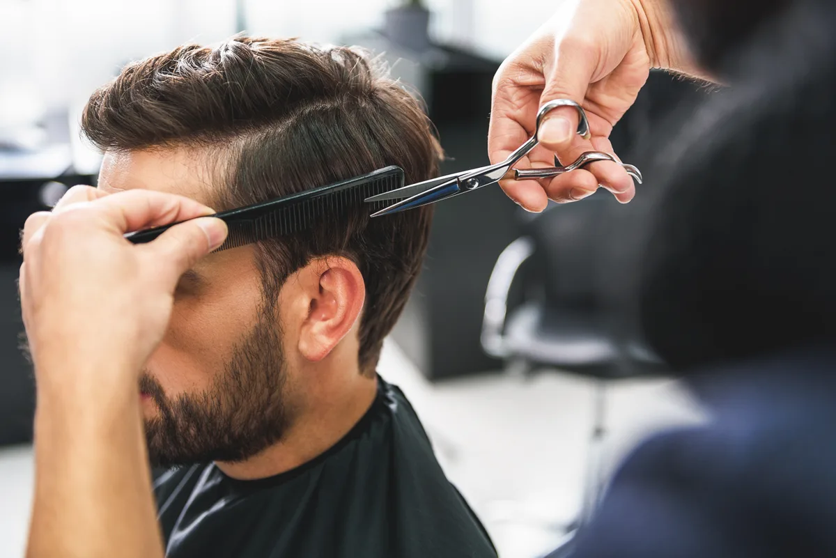 Barber cutting a client's hair