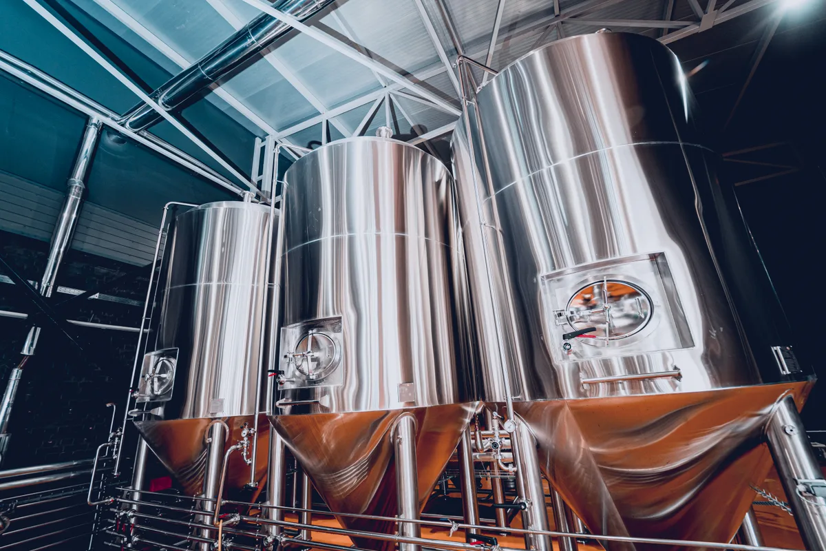 Stainless fermentation tanks in a craft brewery