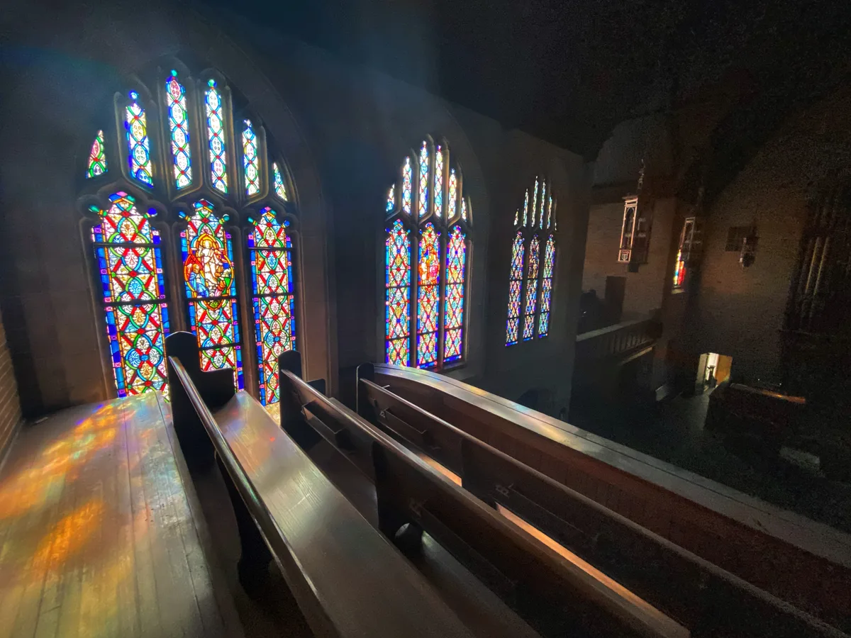 Interior of a place of worship with rows of seating