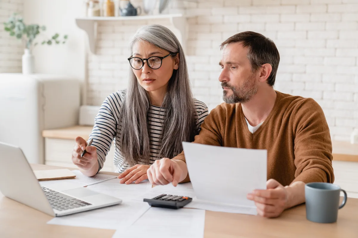 Consultant reviewing documents with a couple