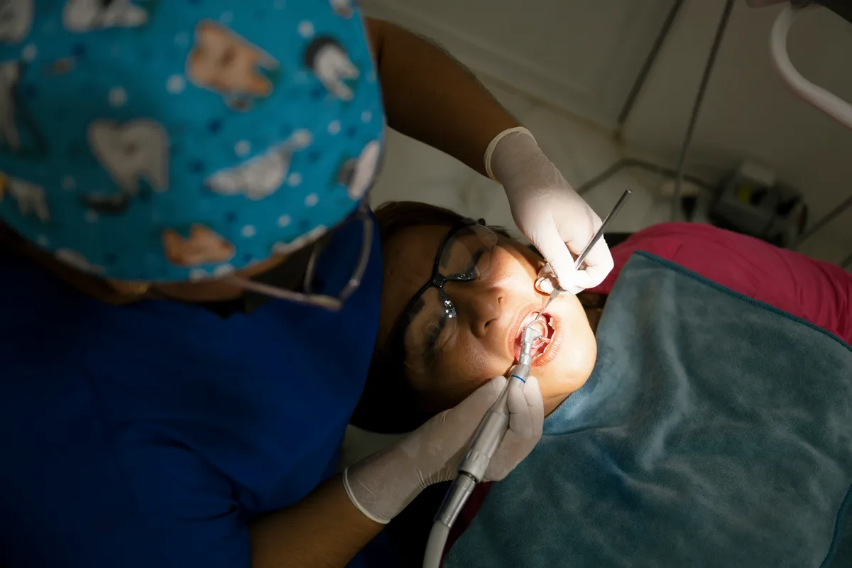 Dental hygienist performing a cleaning