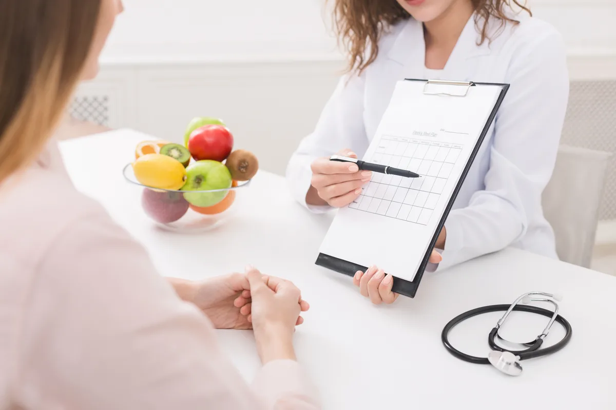 Dietitian reviewing a meal plan with a client