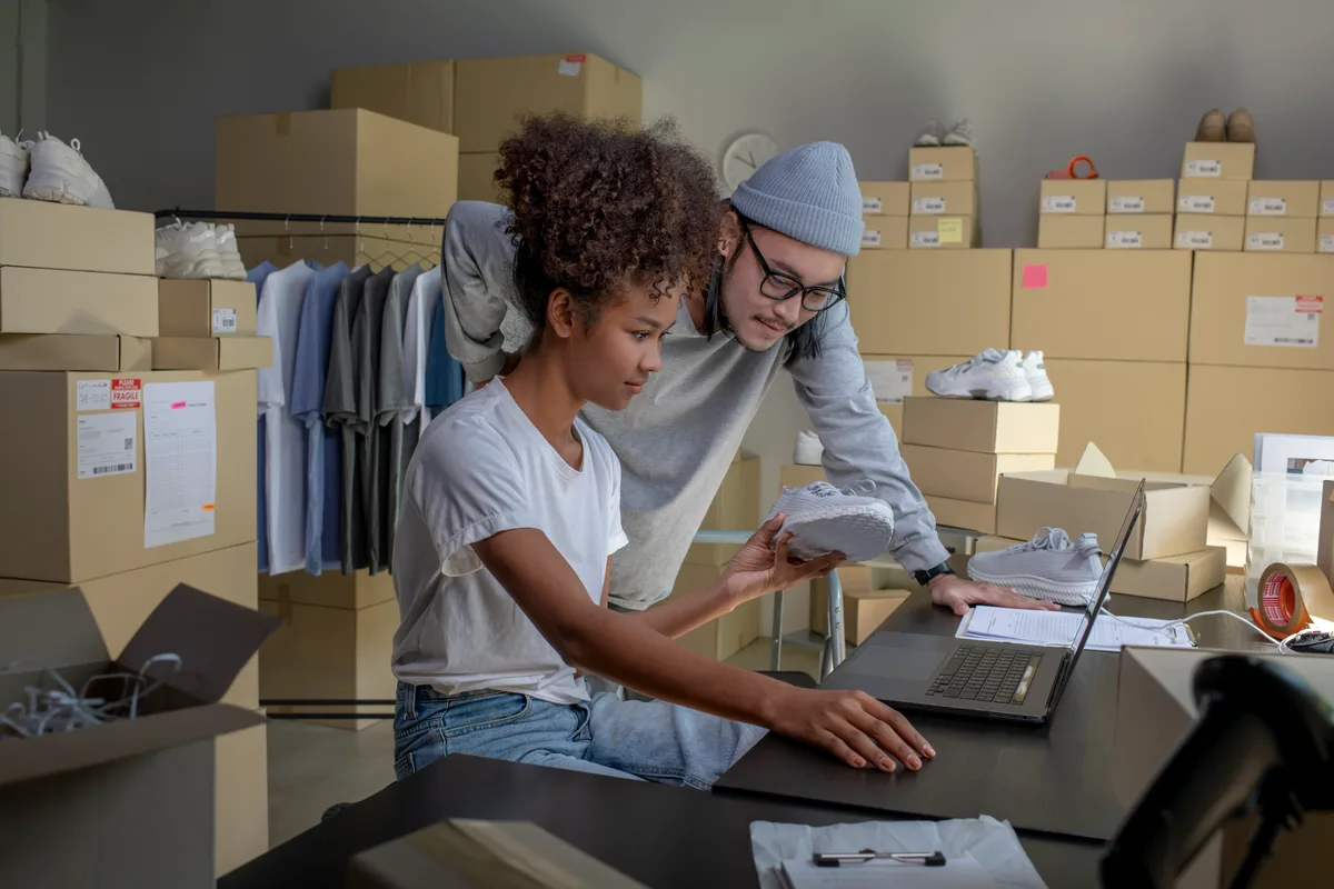E-commerce seller preparing orders in a small warehouse