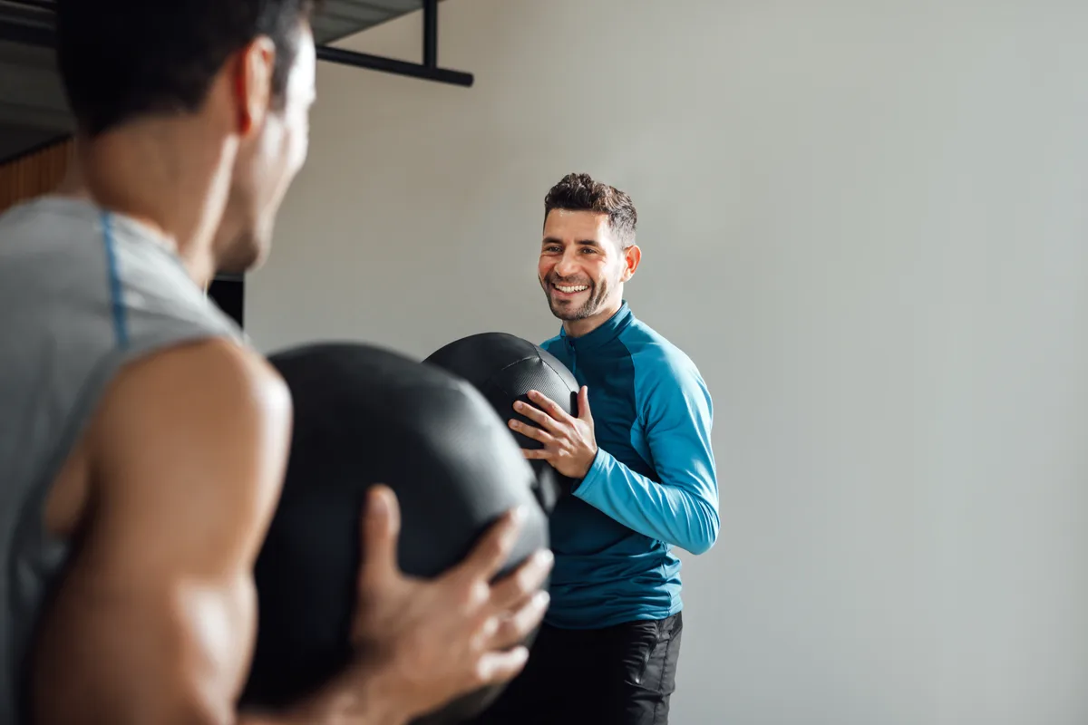 Trainer leading a fitness class in a studio