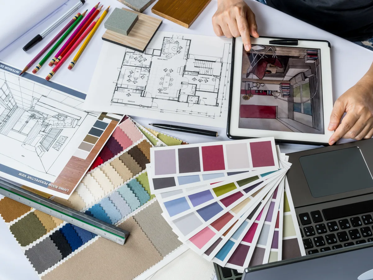 Interior designer working with fabric samples in a studio