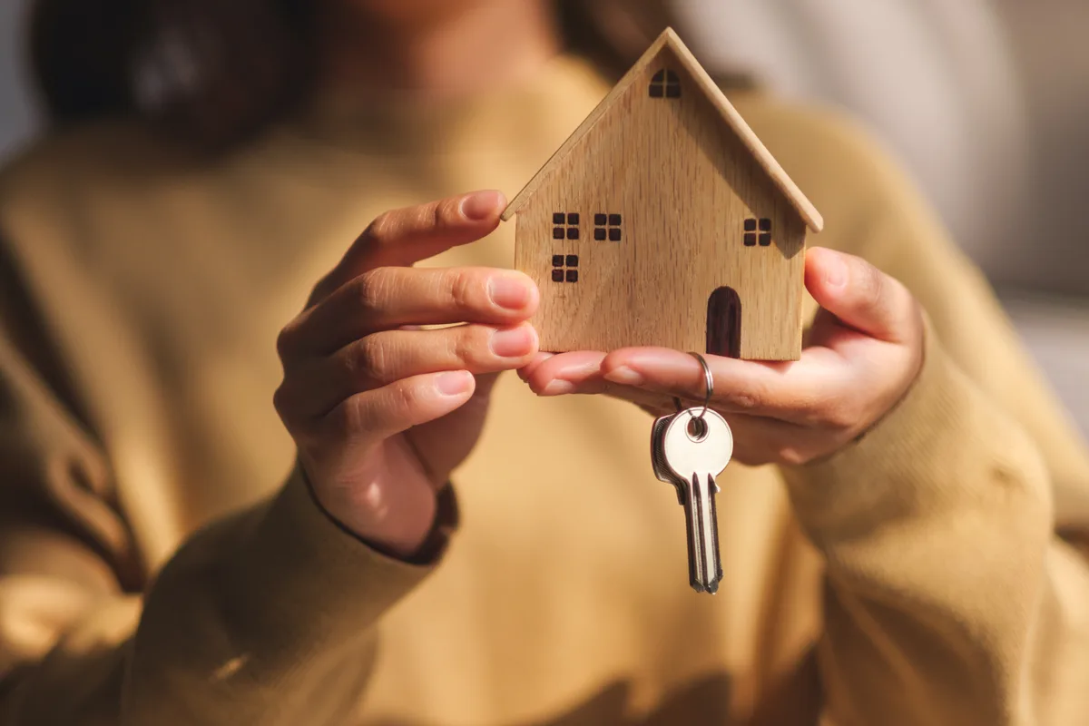 Landlord handing over keys in an apartment