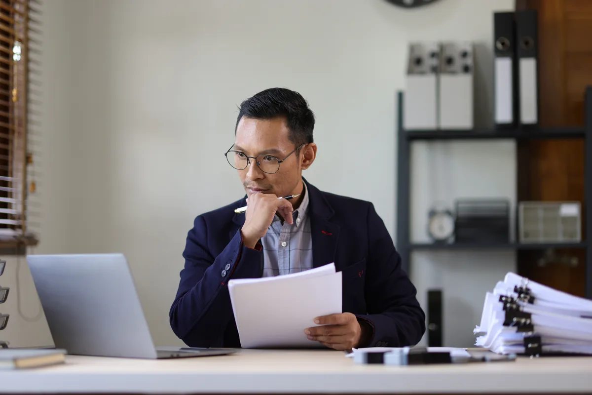 Lawyer reviewing files in an office
