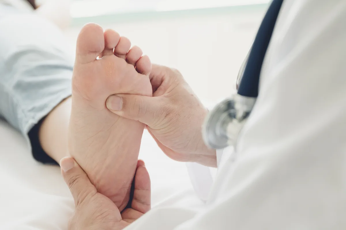 Foot specialist examining a patient