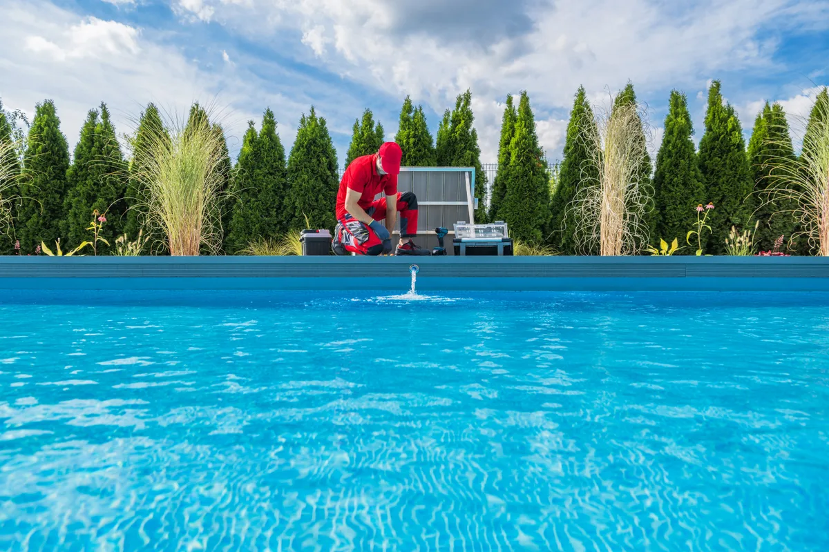 Technician servicing a residential pool