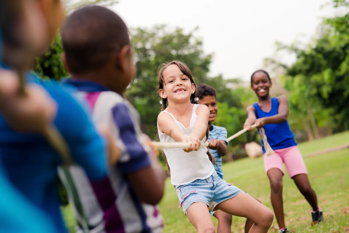 Kids at an outdoor summer camp activity