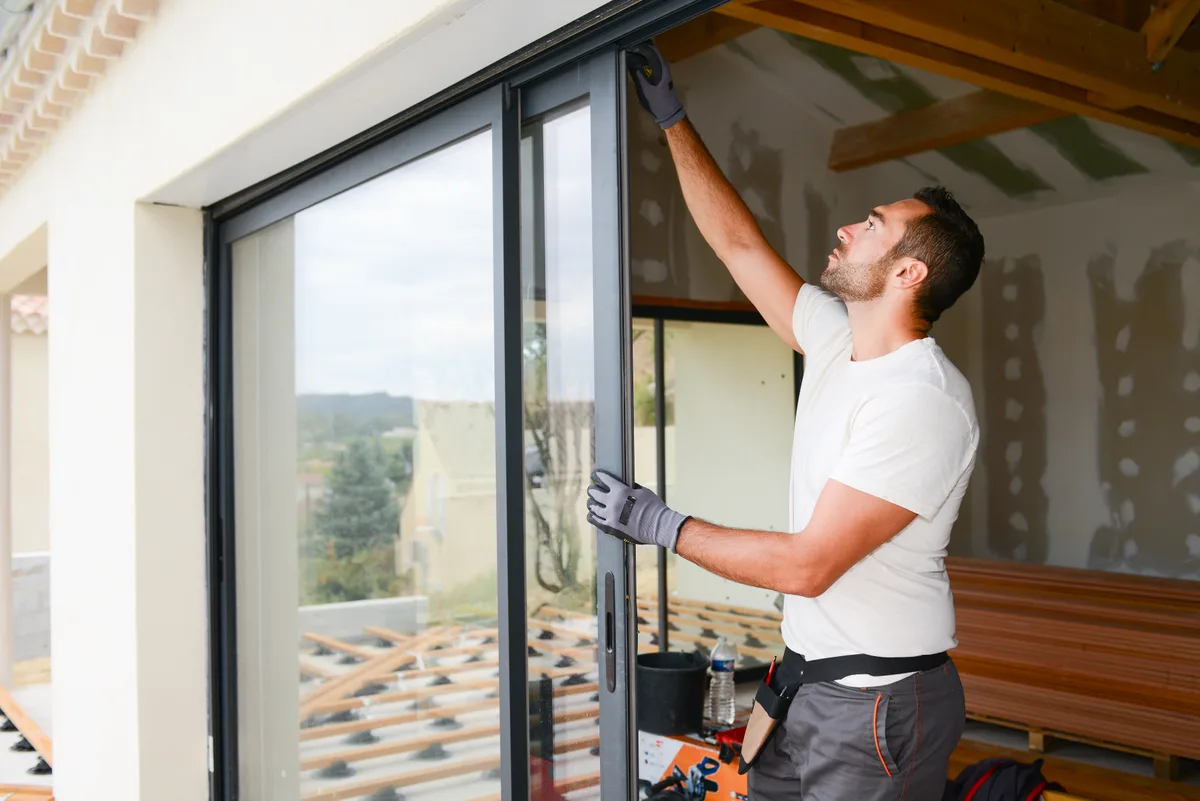 Crew installing a replacement window