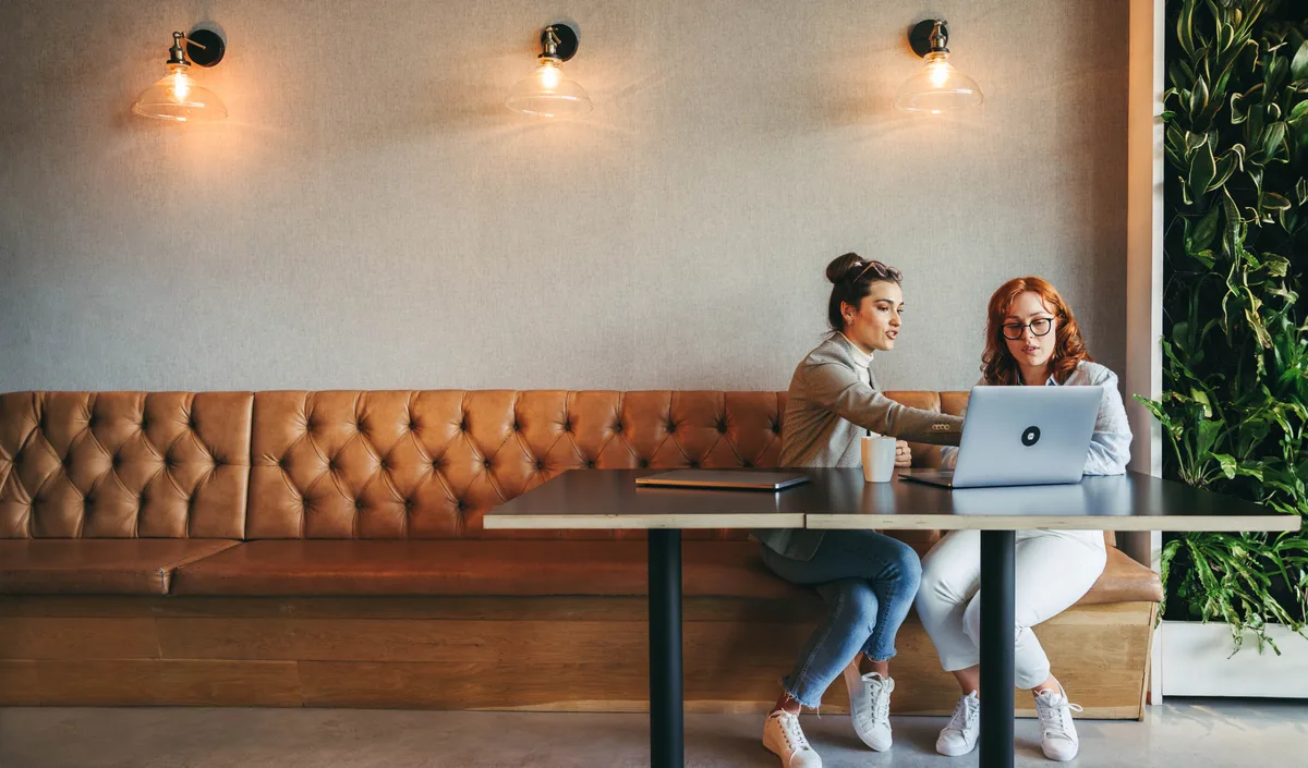 A small team gathered in a bright open-plan office